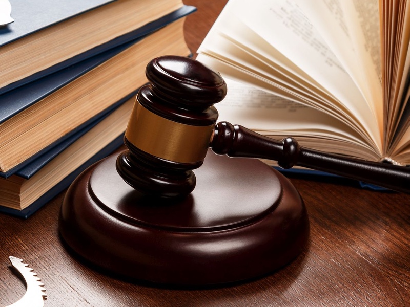 gavel, books and handcuffs