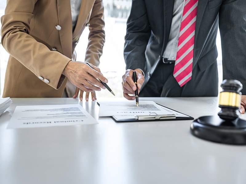 businesswoman and male lawyer or judge consult having team meeti