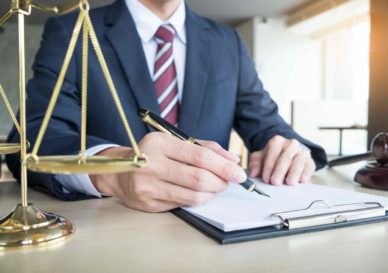 lawyer hand writes the document in court (justice, law)