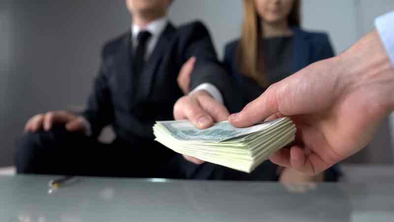 couple giving bribe for illegal deal on real estate market, inheritance fraud